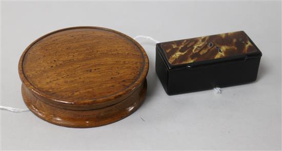 A circular turned oak snuff box and a rectangular lacquered snuff box,